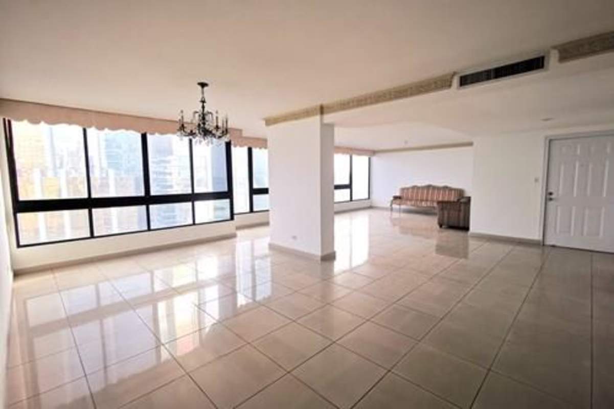Spacious living room with panoramic windows, tile floors and ocean view balcony PH Costa del Mar Panama