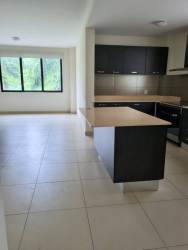Bright open living-dining area with tiled flooring in PH River Valley Panama Pacifico apartment