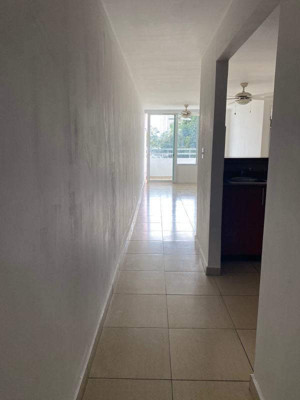 Hallway with tile floor leading to living area and balcony in PH Carrasquilla Urban Center Panama City