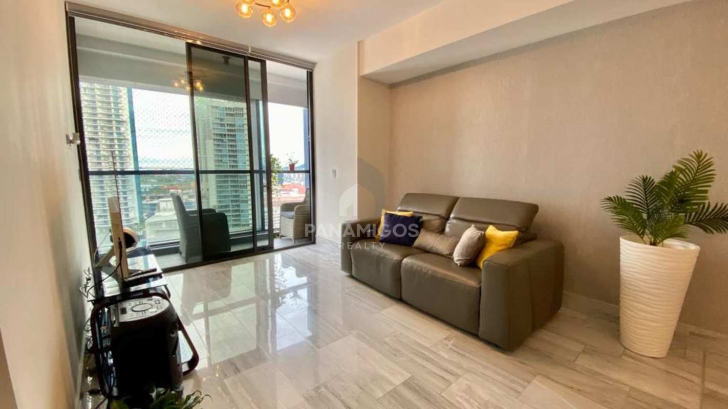 Master bedroom with large windows and city skyline views at Nuovo by Armani Casa