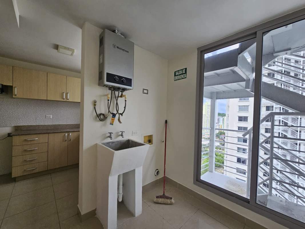 Laundry space with heater balcony exit in PH Rokas Condado del Rey