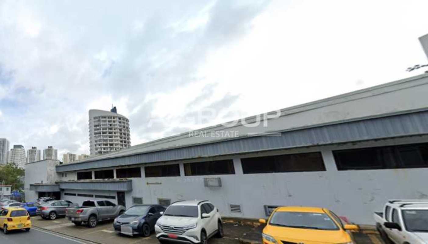 Industrial warehouse with metal awning and city street setting in La Loceria Panama