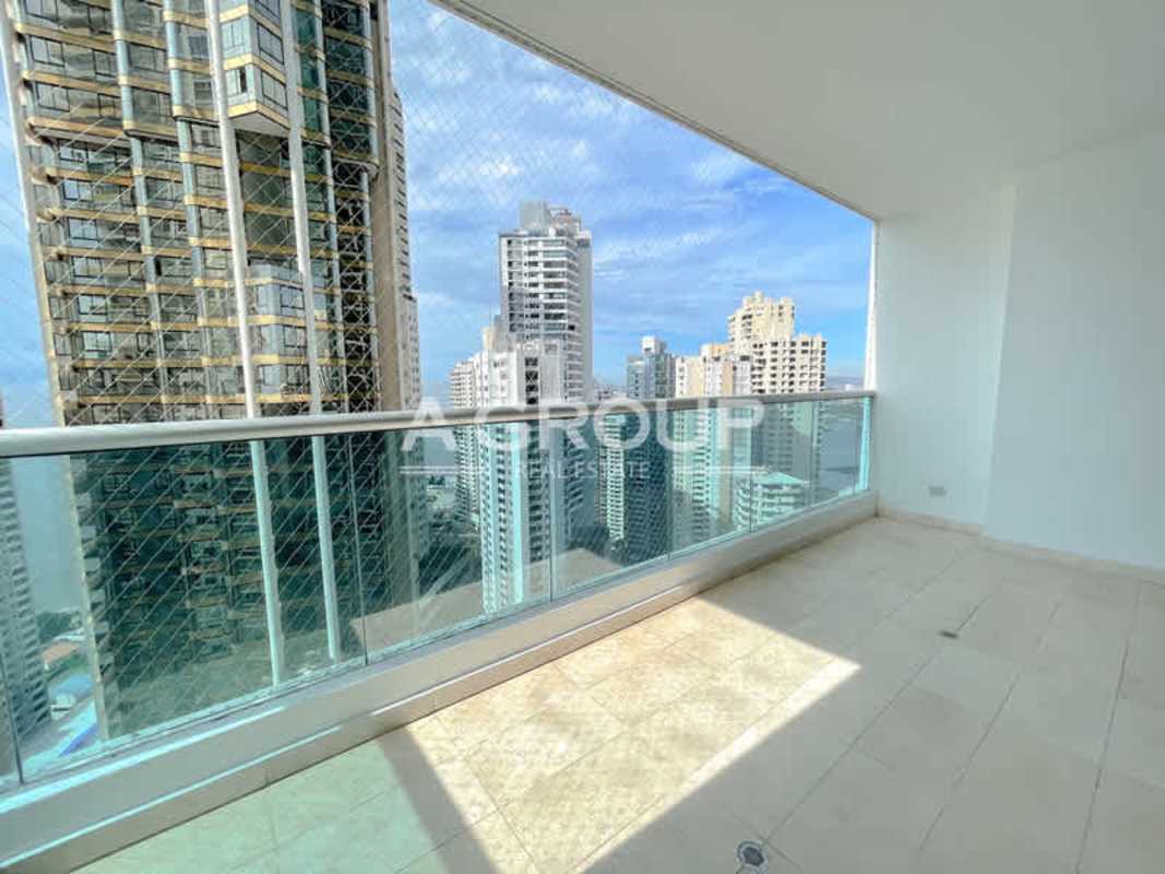 Expansive balcony with glass railing and views of Panama skyline and Pacific Ocean at Aventura Tower Punta Paitilla