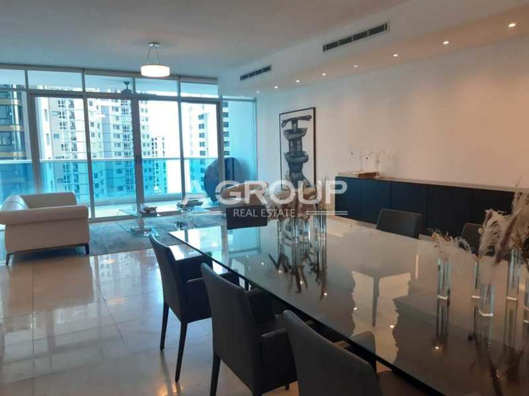 Modern dining area with panoramic ocean views in luxury apartment Aventura Tower Panama City