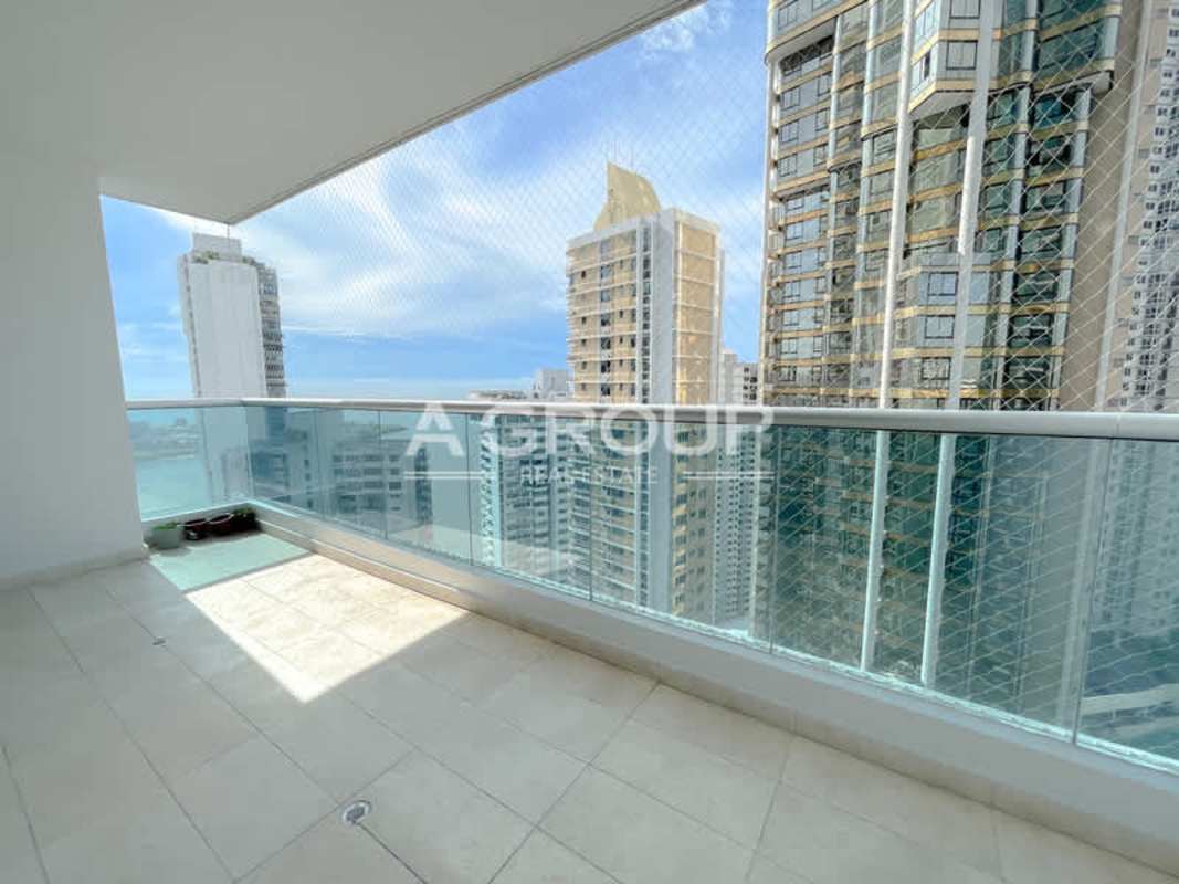 Open kitchen with marble counter and appliances in Aventura Tower Punta Paitilla Panama