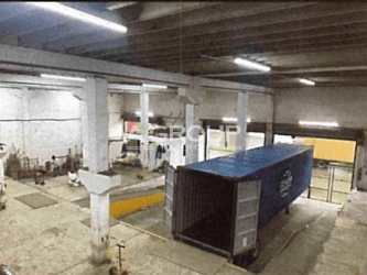 Shipping container and dock access inside logistics warehouse Colón Free Zone Panama