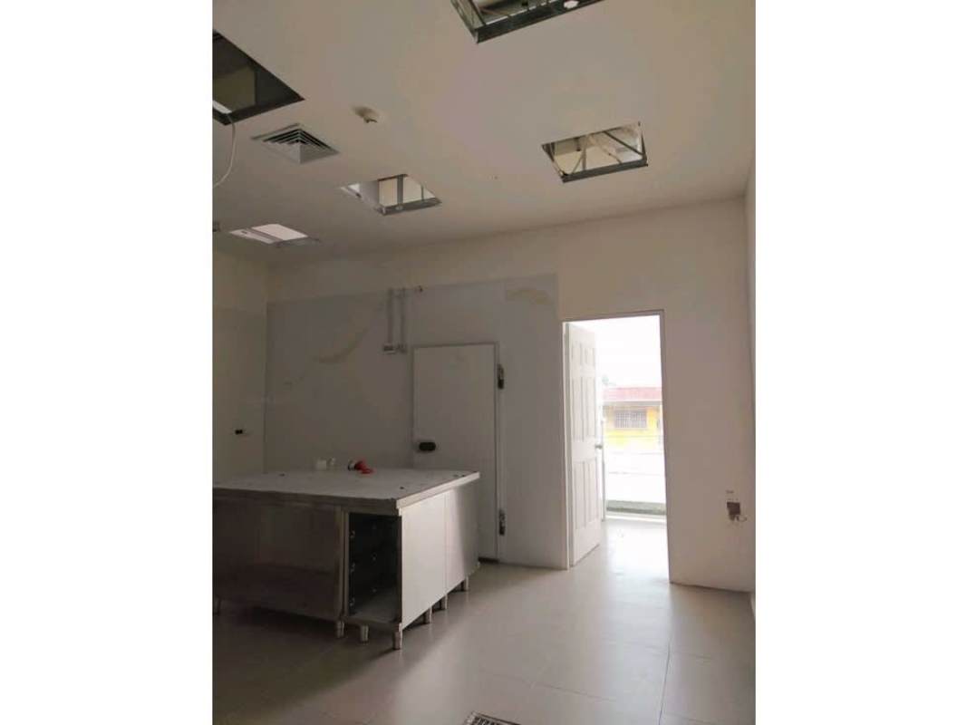 Prep kitchen with stainless table and tall ceiling commercial space Panama City