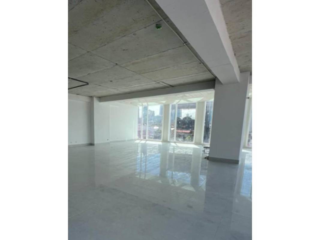 Spacious modern commercial office space with polished tile floors and large windows in Panama City