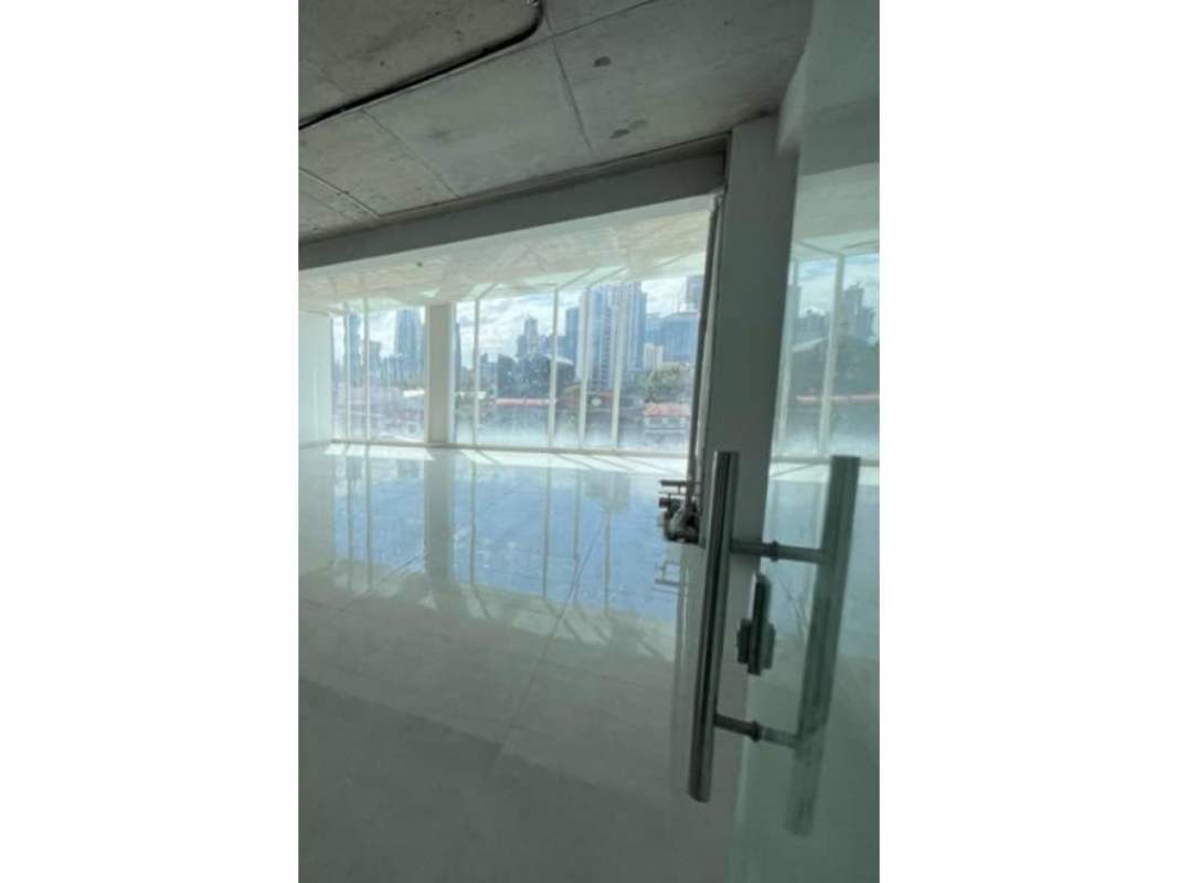 Large windows with panoramic skyline view inside commercial space Panama City
