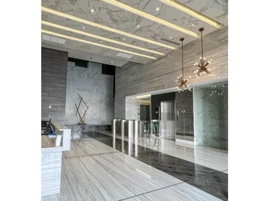 Modern marble lobby entrance with turnstiles and elevators in San Francisco Business Tower Panama City