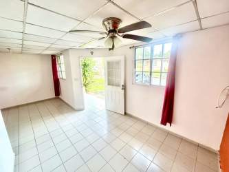 Bright living room with tiled floor windows in affordable house Monterregio Panama