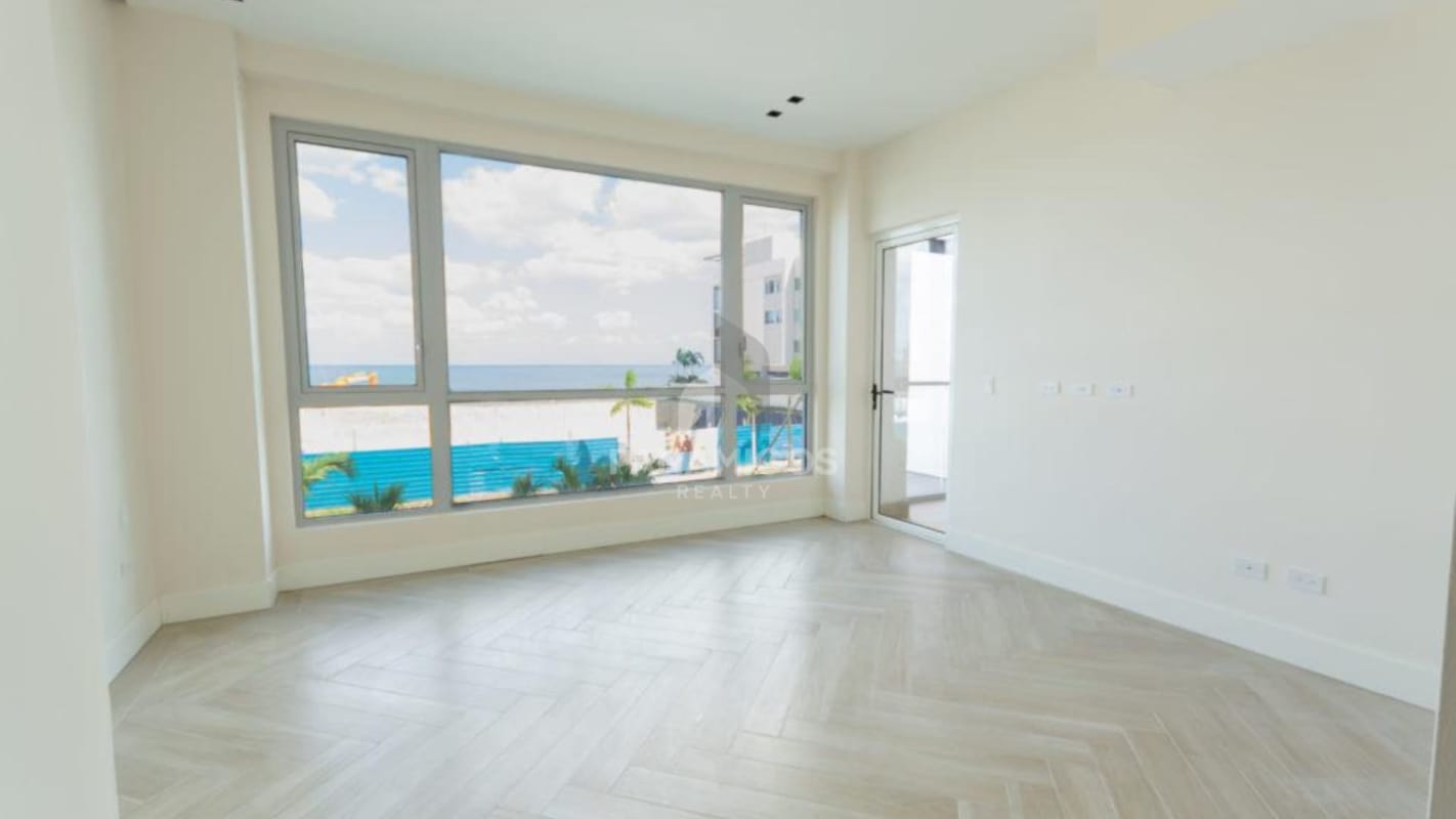 Spacious living area large windows balcony marina view Beach Club Residences Panama