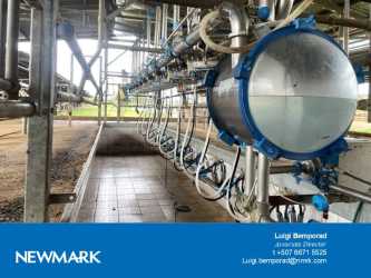 Interior of dairy milking barn with machinery steel pipes at cattle farm La Mesa Santiago Panama