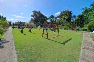 Spacious tiled living dining room with ceiling fans and natural light house for rent in Nuevo Arraiján