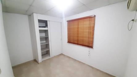Bathroom with glass shower enclosure, pedestal sink and tile walls at PH Quintas de Arraiján Panama Oeste