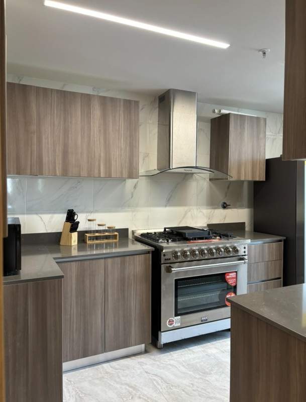 Balcony with panoramic city view ceiling fan and wood tiles in PH Pacific Midtown El Cangrejo Panama