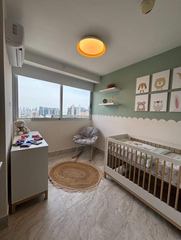 Rooftop infinity pool with palm trees and skyline view in El Cangrejo PH Pacific Midtown Panama