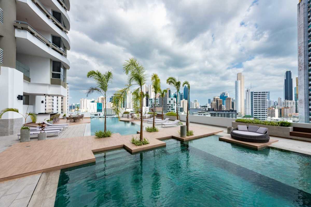 Modern nursery bedroom with baby crib city skyline window PH Pacific Midtown El Cangrejo Panama