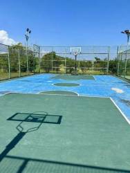 Outdoor swimming pool with garden and seating PH Tucan Country Club Panama