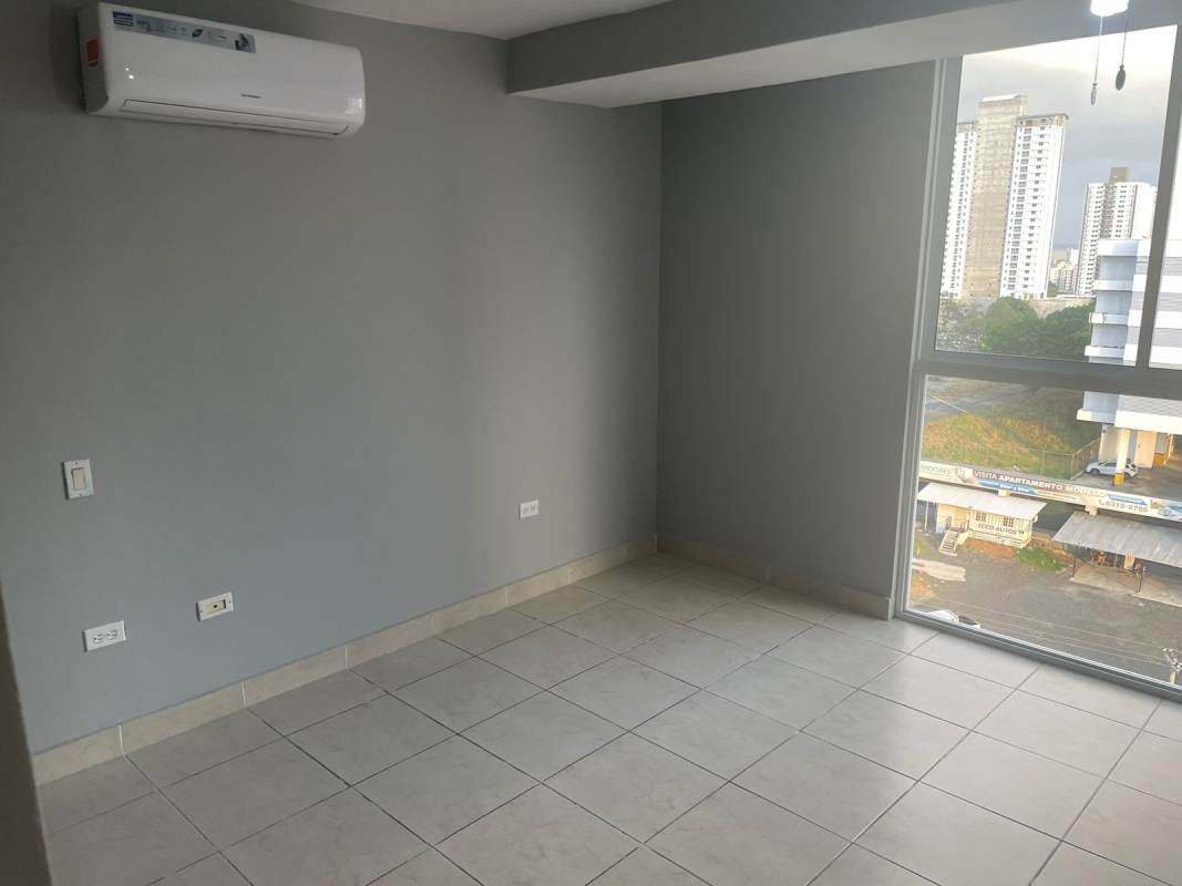 Kitchen with granite counters, cabinets, stove and refrigerator in PH Vista Marina Towers Panama apartment for sale