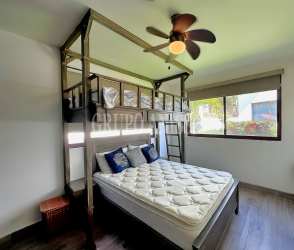 Bright living and dining area with split AC, ceiling fan and terrace in Rio Mar San Carlos