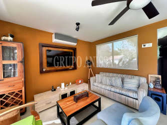 Bedroom with closet and large window, AC and garden view in Rio Mar beach house