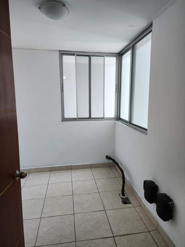 View over building amenities with pool, sports court, playground Central Park Panama