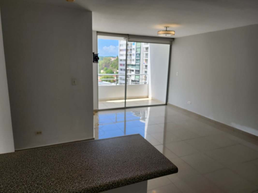 Open living area with balcony access, city views from apartment in Central Park Tower