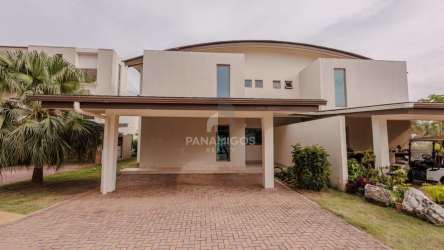 Spacious bedroom with floor-to-ceiling windows and balcony overlooking Caribbean Sea Playa Escondida Portobelo