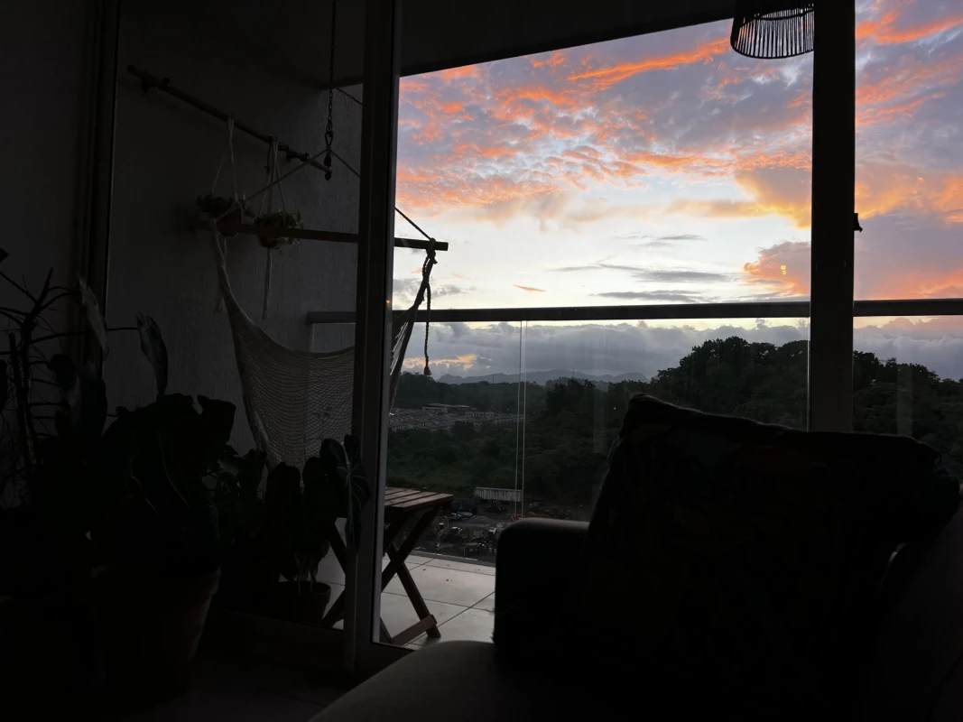 Open living dining area with balcony view and natural light in PH Brisas Tower, Brisas del Golf Panama City