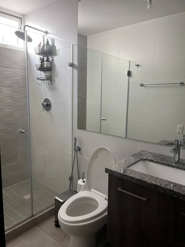 Private apartment balcony with hammock chair and sunset skyline in Brisas Tower Panama City