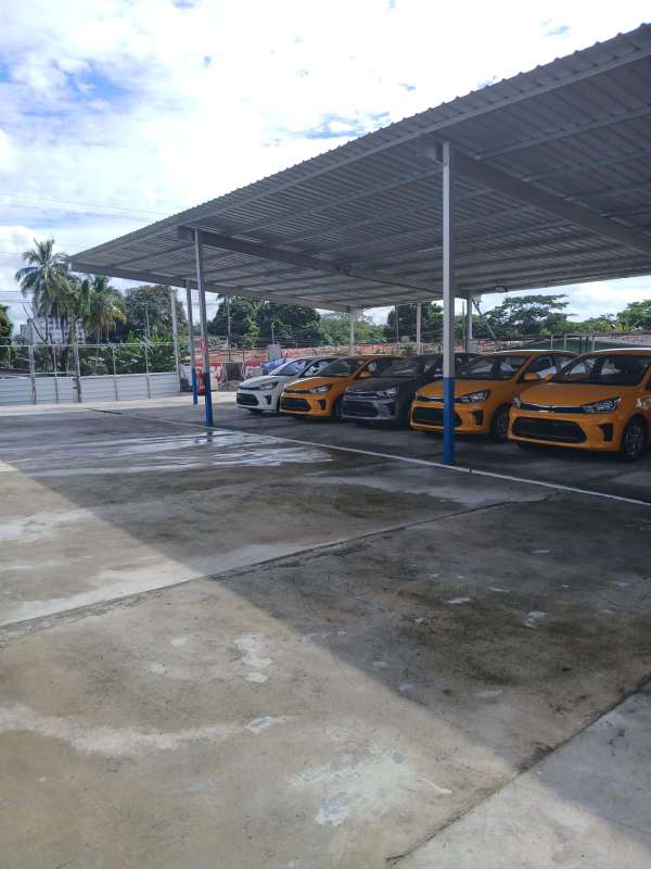 Industrial warehouse front with parking spaces and covered entry in Llano Bonito Panama