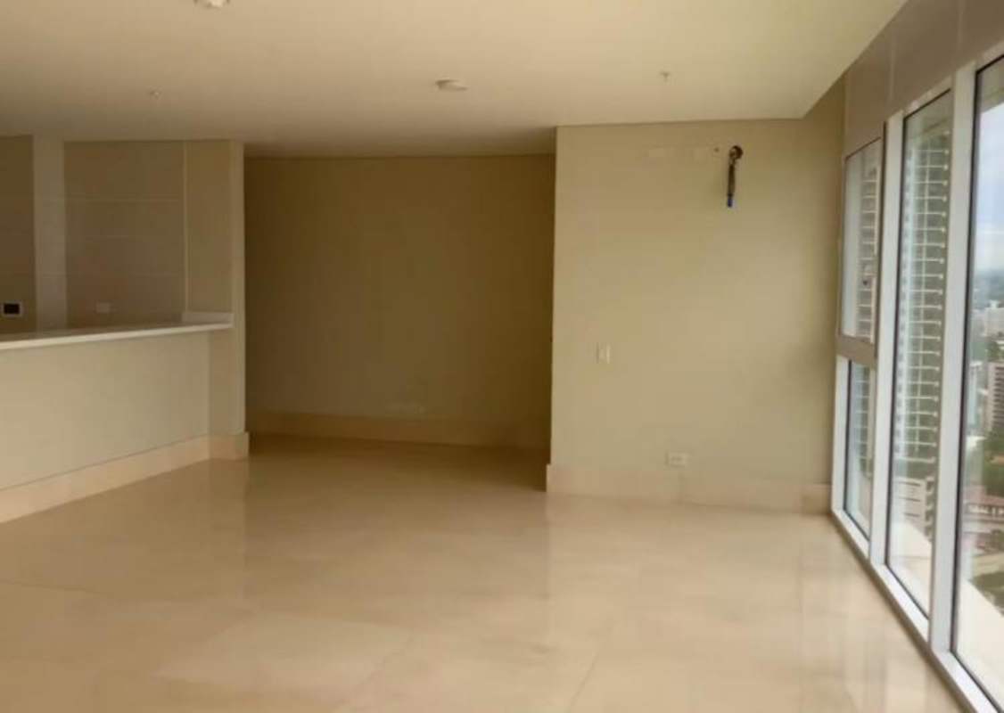 Modern kitchen island design with white cabinetry open layout at PH Windrose Coco del Mar Panama