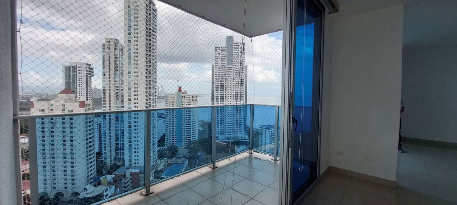 Modern bathroom with glass shower and granite countertop at PH Waterfalls Panama City