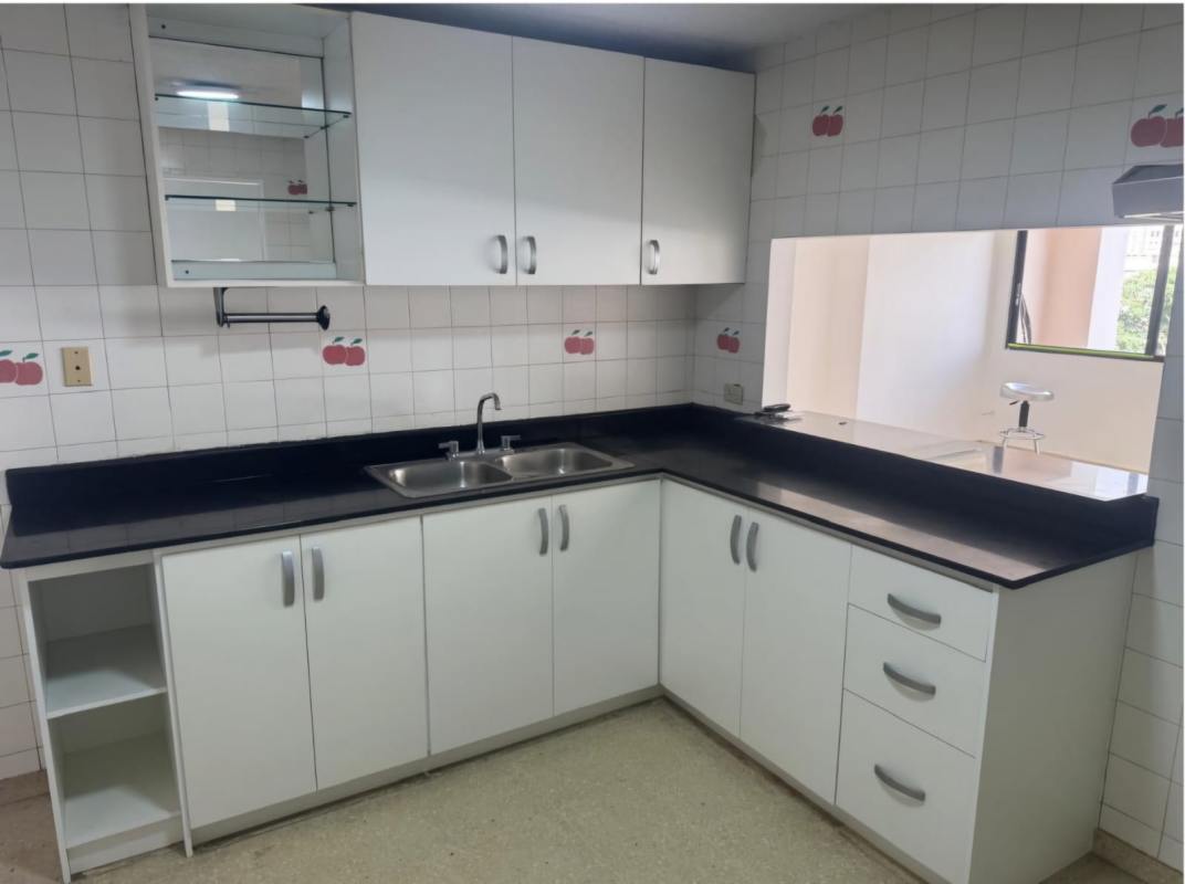 Modern kitchen white cabinets black countertop decorative tile backsplash PH Marfil Obarrio Panama