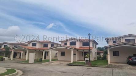 Suburban neighborhood with two-story houses carports lawns Sunset Hills Costa Verde Panama