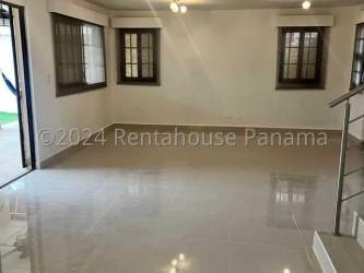 Modern bathroom with vessel sink, white fixtures and mosaic accent strip in Sunset Hills Costa Verde Panama
