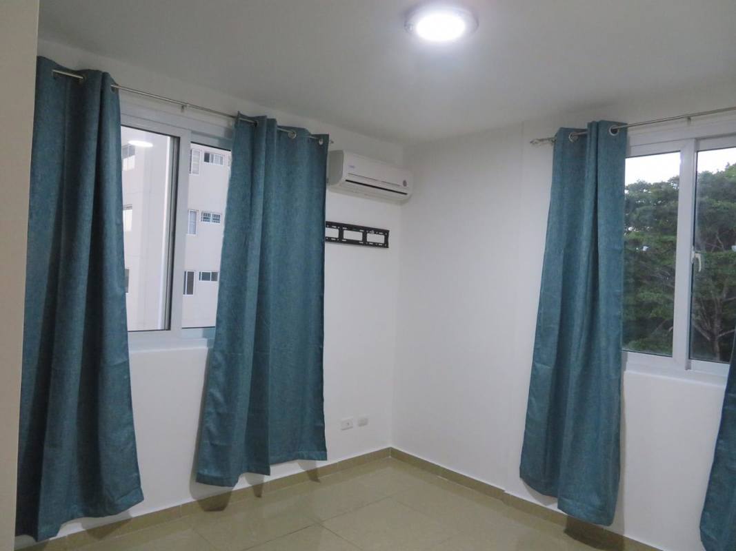 Aerial view of swimming pool with gazebo, lush gardens in Villa de las Fuentes Panama City