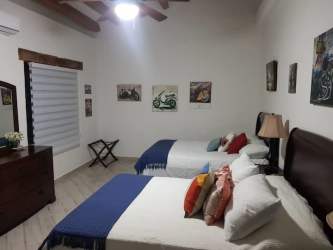 Spacious bedroom in beachfront villa with rustic style and ocean view at Playa Rincón Pedasí