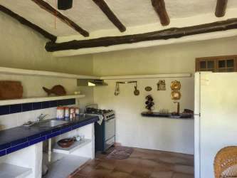 Terrace with hammock, colorful decor, view of garden and pool at Coronado beach rental Panama