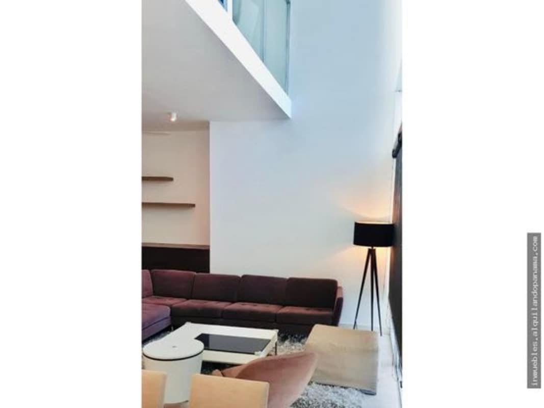Modern minimalist loft living room double height ceiling at PH Pacific Village Punta Pacífica Panama