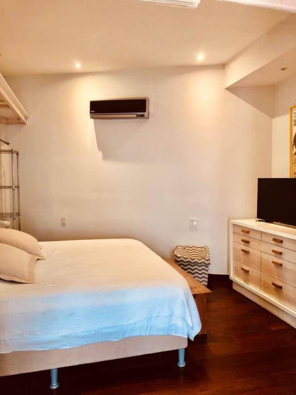 Minimalist style bedroom with wood floors, AC, colonial accents in Casco Viejo Panama