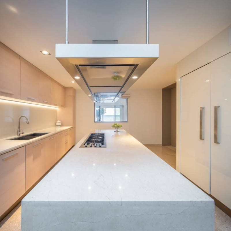 Luxury villa kitchen with marble island, integrated appliances, minimalist design in Punta Paitilla Panama