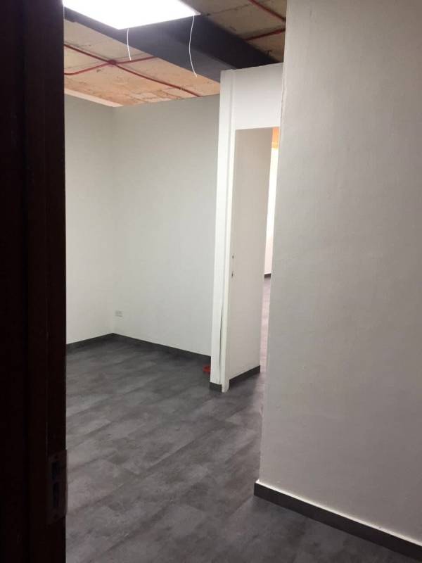 Interior entrance hallway unfinished ceiling exposed wiring in PH BICSA on Avenida Balboa Panama