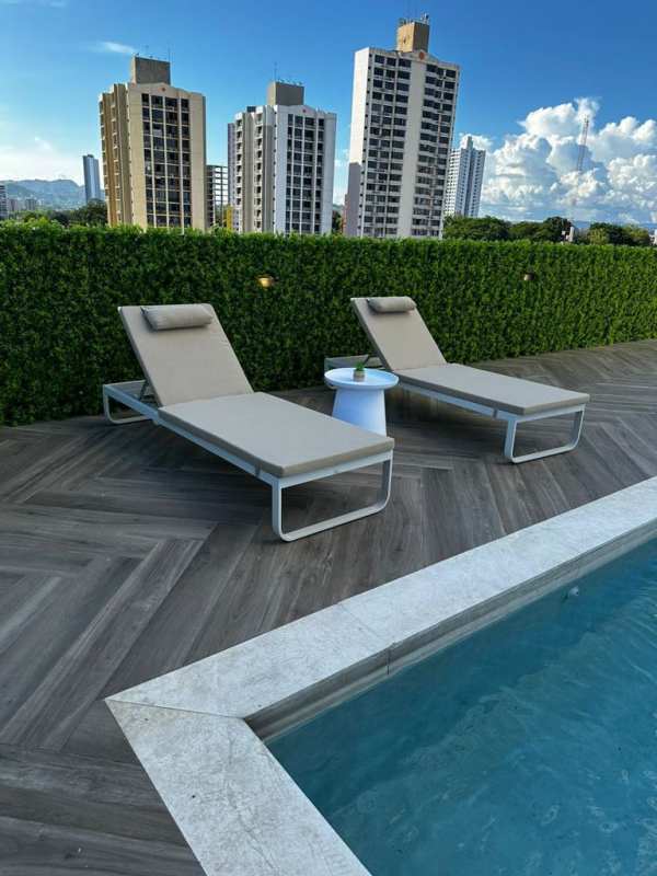 Modern pool terrace with loungers overlooking Panama City at CenterPoint Tower