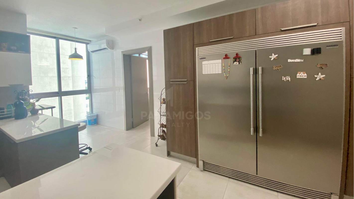 Large modern kitchen with granite countertops, premium cabinetry in PH Regalia Costa del Este panoramic ocean view apartment