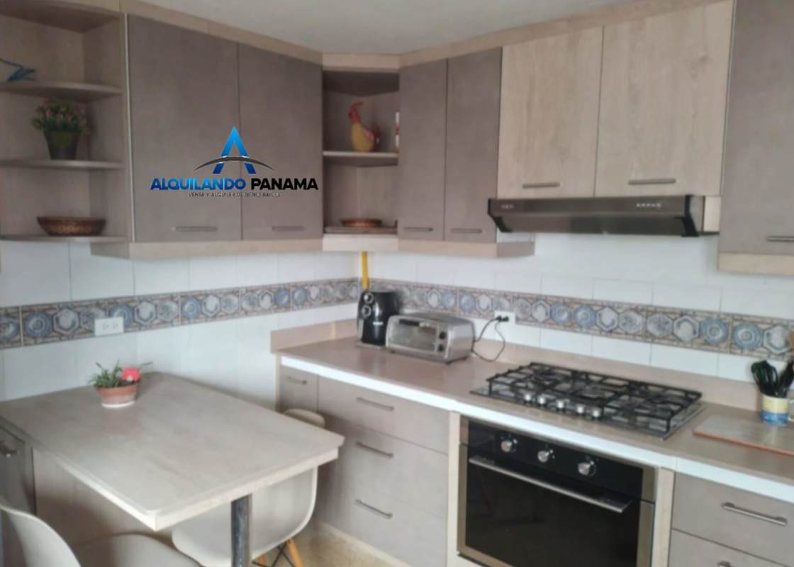 Modern kitchen with oven, stove, cabinets and dining nook PH El Carmen Panama
