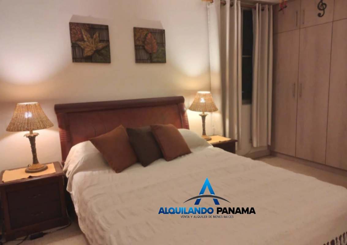 Secondary bedroom with bed, curtains and wall art PH El Carmen Panama