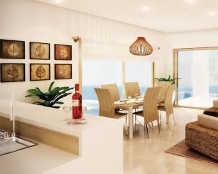 Contemporary kitchen with breakfast bar stainless appliances in Caribbean condo Panama
