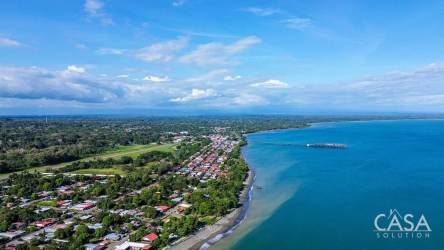 Aerial view coastal town with beachfront greenery and mountains Panama